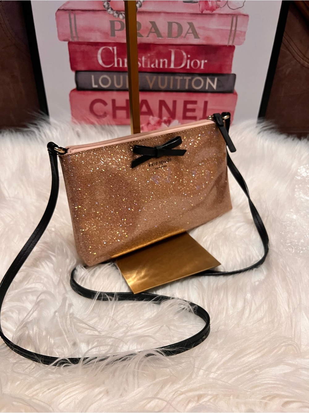 kate spade rose gold glitter crossbody with black strap and bow